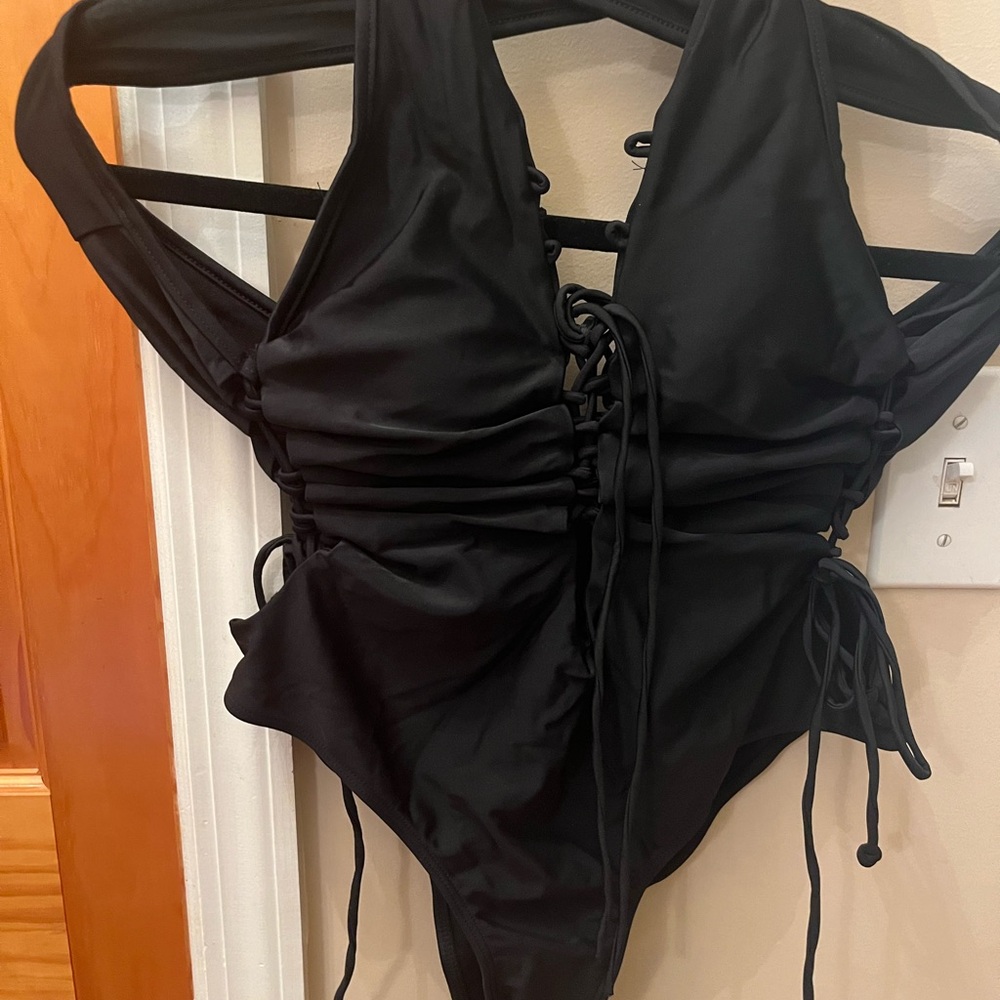 Brand new  Holipick black lace-up one-piece swimsuit.
Size xl